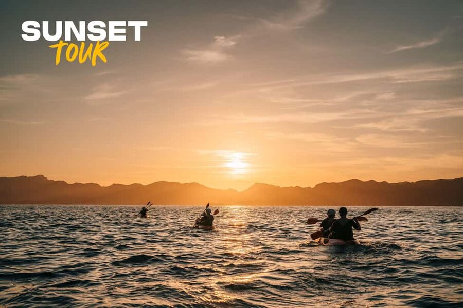 Alcudia: Guided Sea Kayaking Tour with Snorkeling - Entering the sea caves