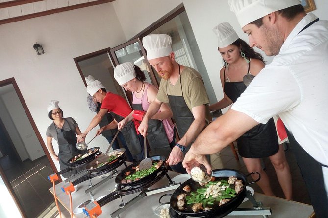 Authentic Valencian Paella Cooking Class - Putting on the apron and making paella