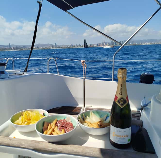 Barcelona Badalona : Sailboat Tour, Snacks, Drinks, Swimming - The first hour: sailing along Barcelona’s coast
