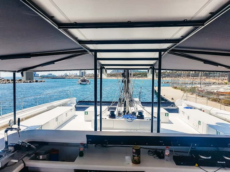 Barcelona: Catamaran Party Cruise with BBQ Meal - The Mediterranean swim stop
