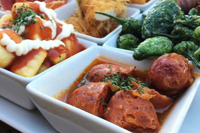 Barcelona Food Tour: Tapas, Drinks and Delights with a Local - Plaça de Sant Josep Oriol adds art and pintxos