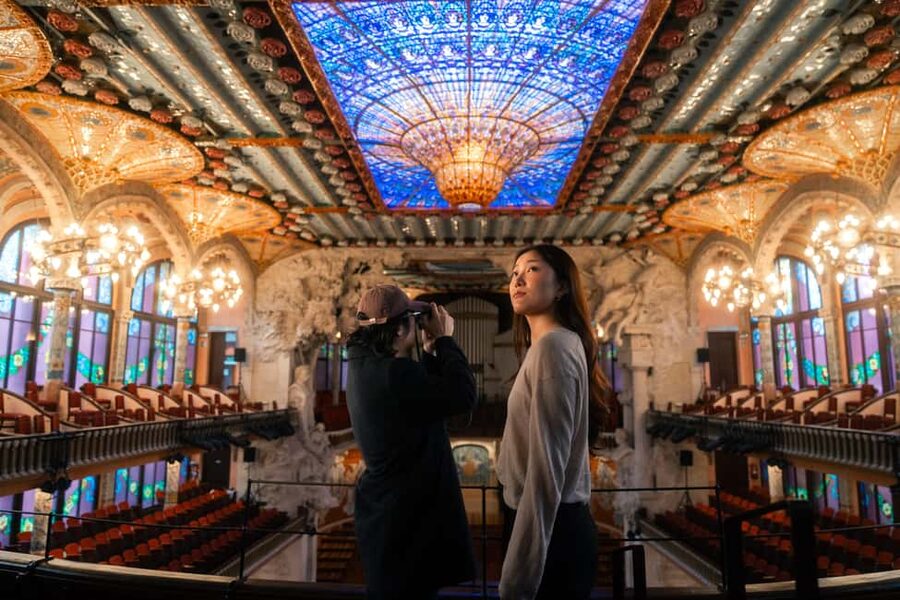 Barcelona: Palau de la Música Self-Guided Tour - The grand staircase and its flowers, iron, and glass
