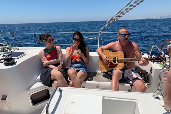 Barcelona Private Sailing Tour with Drinks for Family and Friends - Drinks, local snacks, and your own music