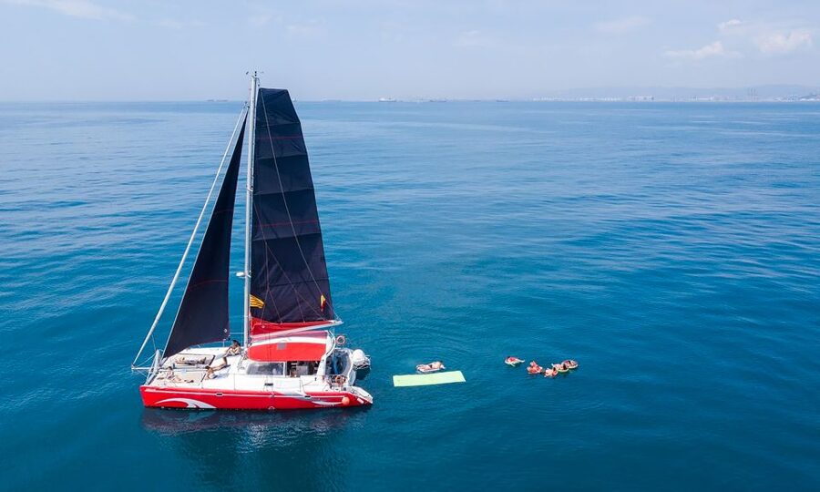 Barcelona: Sunset or Day Catamaran Cruise with Tapa & Drink - A welcome drink and a small taste of Catalonia