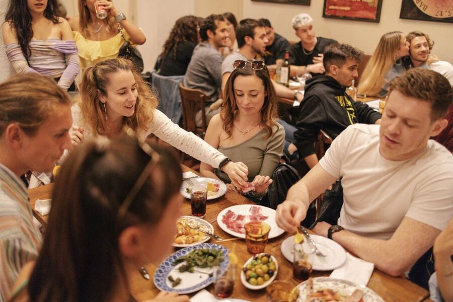 Barcelona: Tapas Food Crawl Walking Tour with Tastings - Walking toward the Gothic Quarter