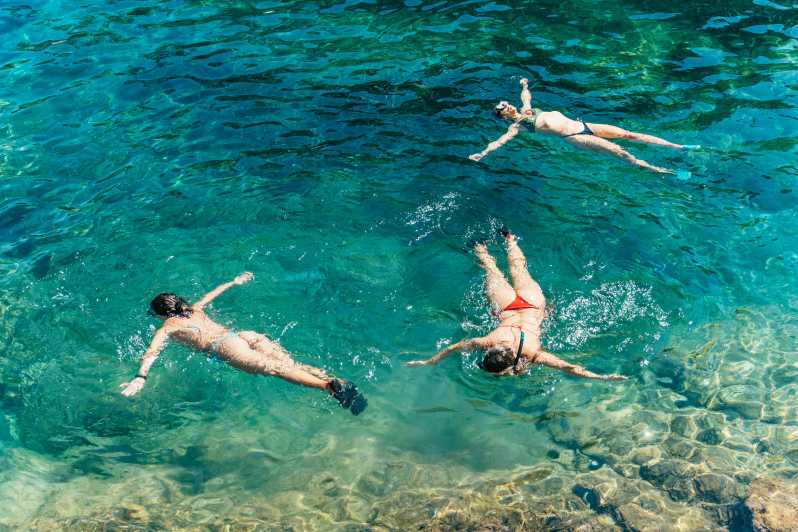 Barcelona: Tossa de Mar Kayak & Snorkel Tour w/3-Course Meal - Three hours by kayak through caves and coves