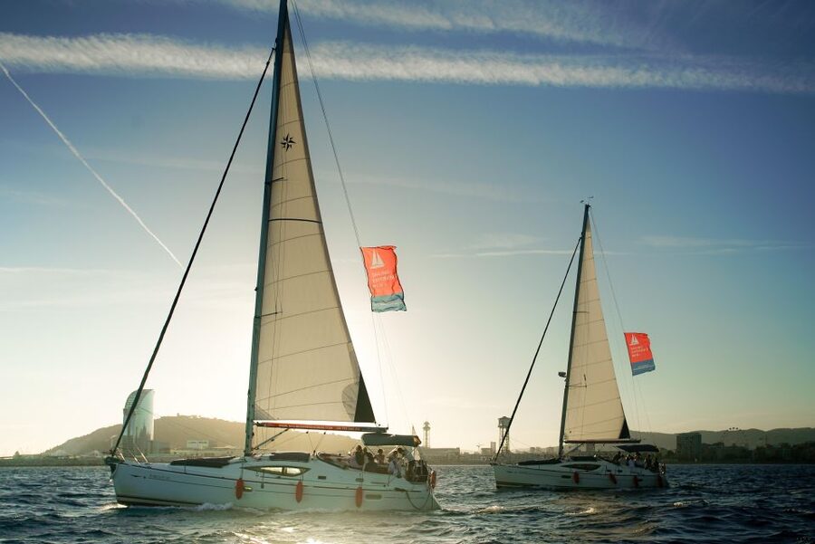 Barcelona: Unique Sunset Sailing Tour with Tapas & Open Bar - What the crew adds to the experience
