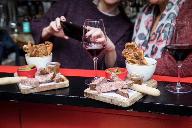 Barcelona Wine and Gourmet Tapas Tour - Eixample architecture between plates