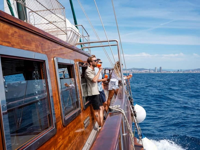 Barcelona: Wooden Boat Sailing with Tapa and Welcome Drink - Rooftop views, lounge comfort, or aft relaxation