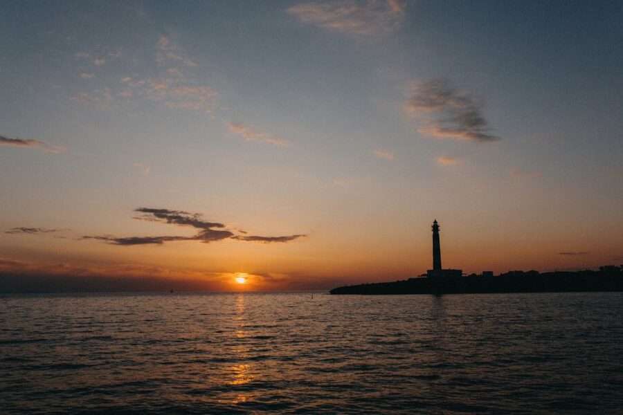 Cala'n Bosch: 2-Hour Sunset Sightseeing Tour - Artrutx Lighthouse gives the cruise its first landmark