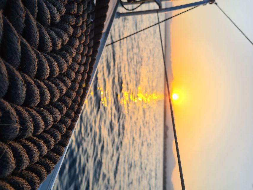 Cambrils: Costa Dorada Sunset Catamaran Cruise with Drinks - Drinks, music, and the value of the $38 fare