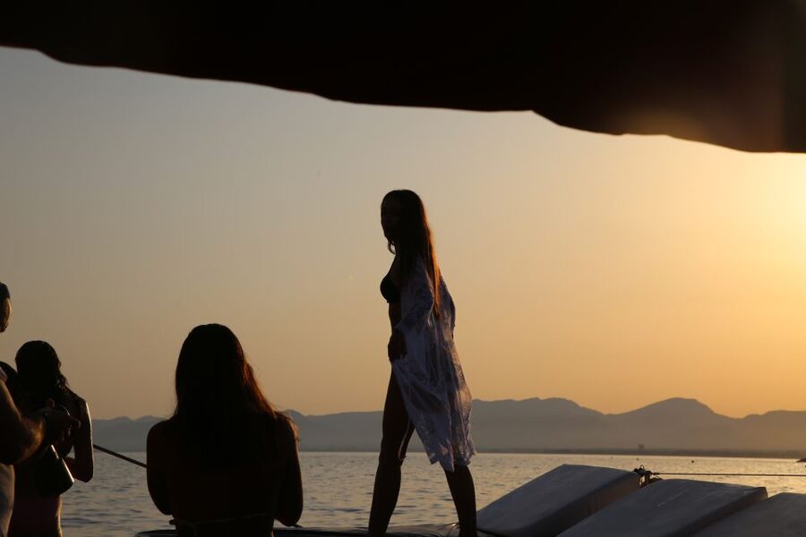 Cambrils: Sunset Catamaran Cruise with Drinks - Sunbeds, music, and the onboard mood