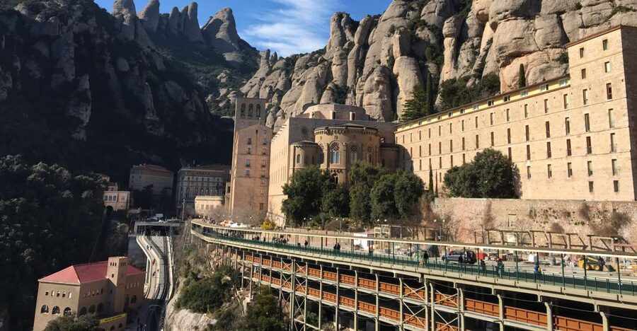 From Barcelona: Montserrat Monastery & Scenic Mountain Hike - Entering the Benedictine monastery