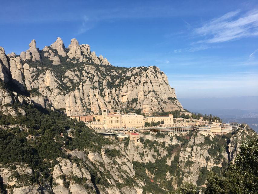 From Barcelona: Montserrat Monastery & Scenic Mountain Hike - Riding the funicular above the abbey