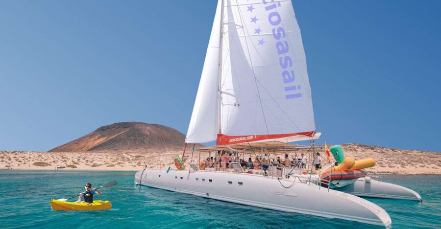 From Lanzarote: Sailing Day Trip Around La Graciosa - Boarding the catamaran in La Graciosa
