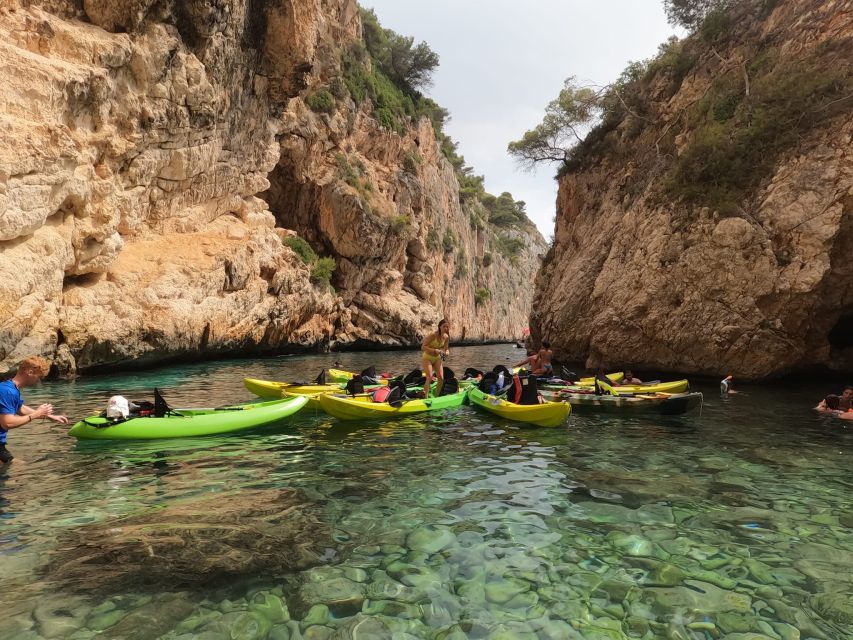 Granadella: Caló, Cova Llop Marí, and Ambolo Kayak Trip - What is included, and what you should bring