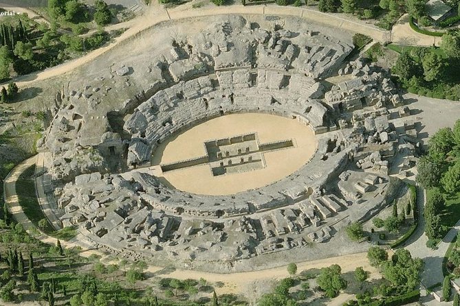 Historical Italica: Half-Day Guided Tour from Seville - The amphitheater and its underground passages