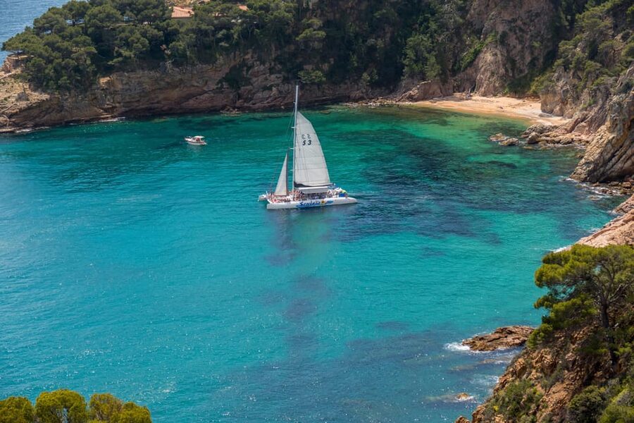 Lloret de Mar: Catamaran Sailing Cruise with BBQ and Drinks - Two hours anchored for swimming and snorkeling