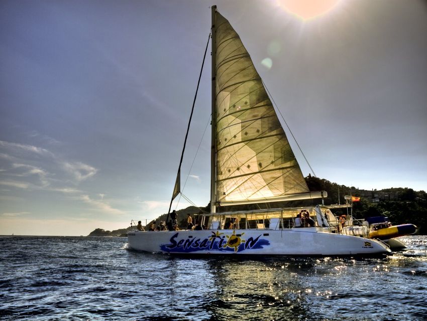 Lloret de Mar: Sunset Catamaran Cruise with DJ and Drinks - Two hours along the Costa Brava