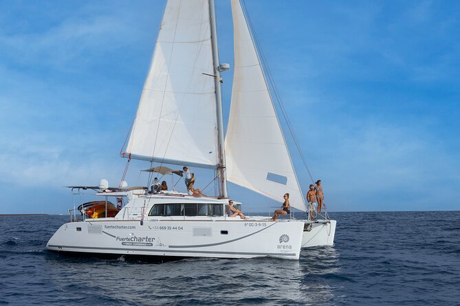 Lobos Island Half-Day Sailing Tour with Lunch - Seeing the old port, lighthouse, and volcano from the sea