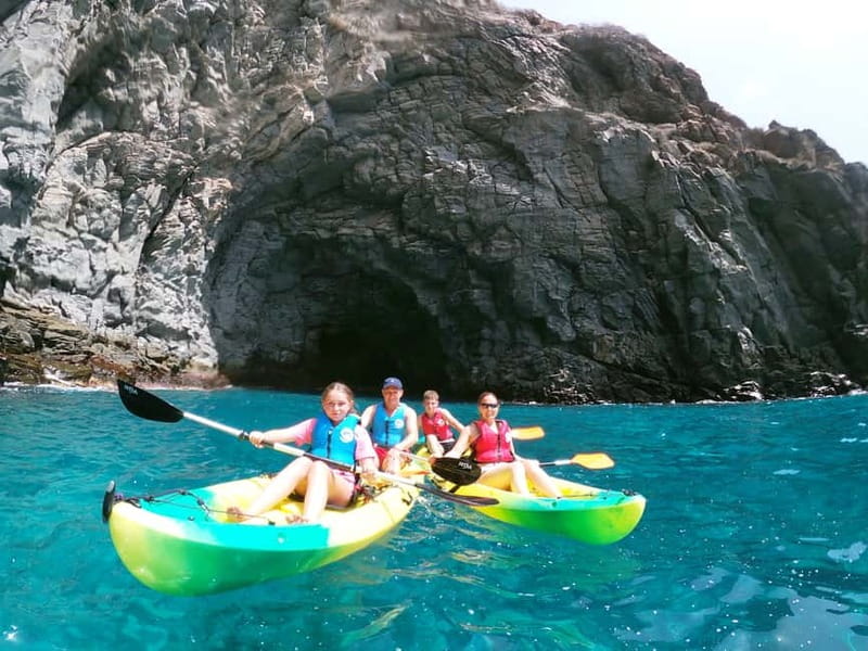 Los Cristianos: Kayak and Snorkel with Turtles and Photos - Paddling past Los Cristianos and the black cliffs