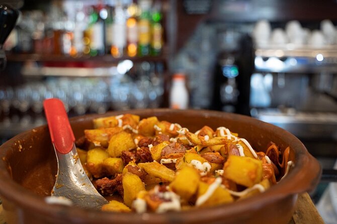 Madrid by Night: Tapas Crawl, Local Drinks & Hidden Gems - Plaza Mayor and Madrid’s famous calamari sandwich