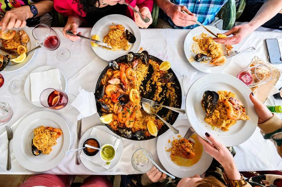 Madrid: Paella and Sangria Workshop in the City Center - Chopping, stirring, and sharing the work