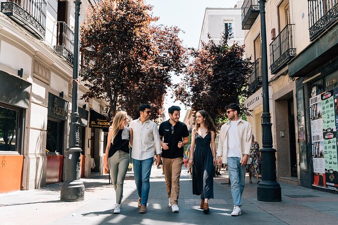 Madrid Tapas & Wine Tour with Rooftop Views and Local Guide - Plaza Mayor and Iberian ham in a specialty shop