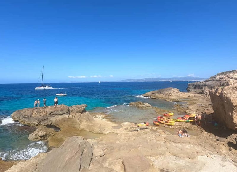 Mallorca: Sea Cave Kayaking Tour with Snorkeling and a Snack - The snack stop gives your arms a break