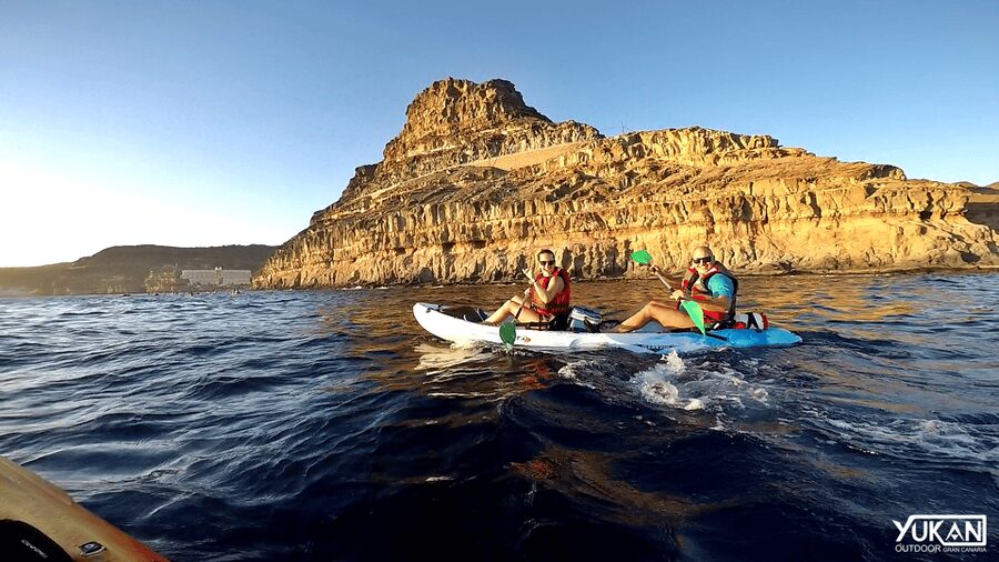 Mogán: Guided Kayak to Caves and Snorkeling Tour - Paddling beneath white cliffs