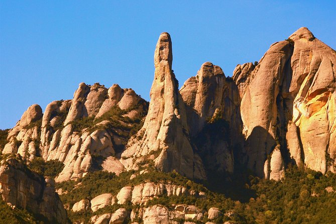 Montserrat Half Day with Cable Car and Easy Hike from Barcelona - Entering Montserrat’s monastery and basilica