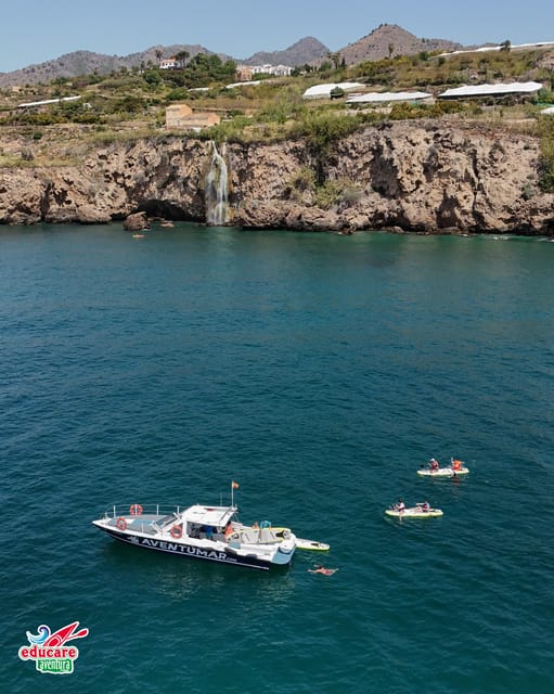 Nerja: Maro Waterfall Boat Trip with Paddleboarding & Drink - Paddling across the cove to Maro Waterfall