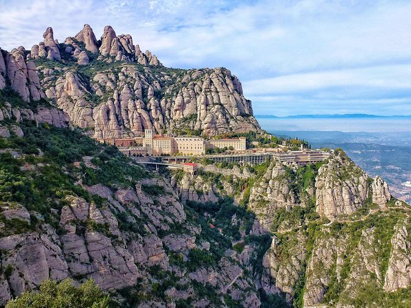 Panoramic Barcelona and Montserrat with Cog-Wheel Train - Passeig de Gràcia reveals Gaudí without an admission ticket