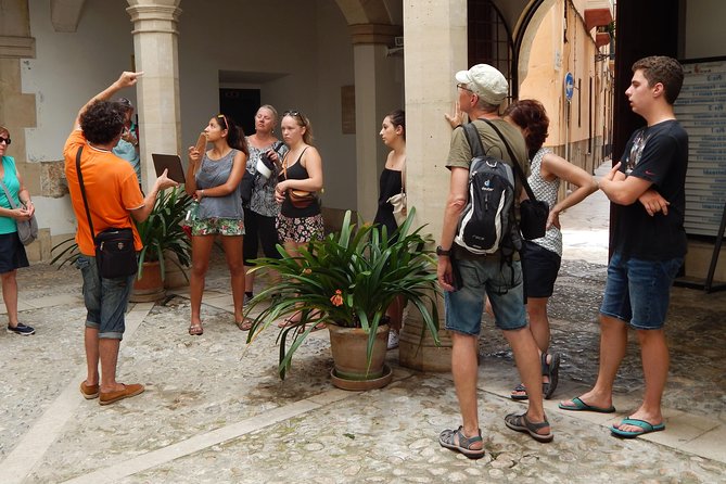 Private walking tour in Palma de Mallorca with local guides. - Orange trees, olive oil, and the Olivar Market
