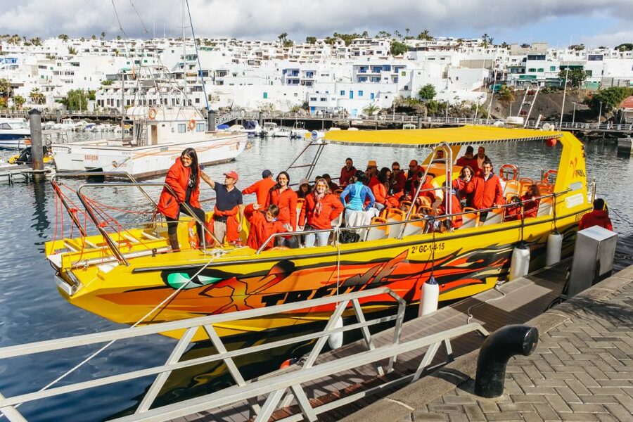 Puerto del Carmen: Dolphin-Watching Speedboat Tour with Swim - Leaving Puerto del Carmen on the Biosfera Jet