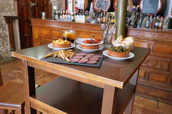 Sevilla Food Tour: Tapas, Wine, History & Traditions - Walking through Seville’s historic center