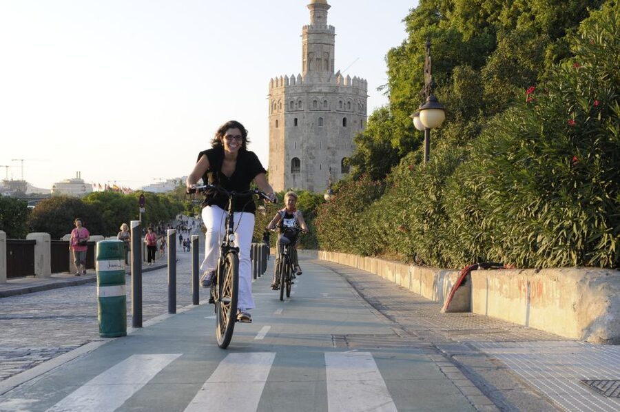 Seville: Electric Bike Tour in Small Group - Crossing into Triana