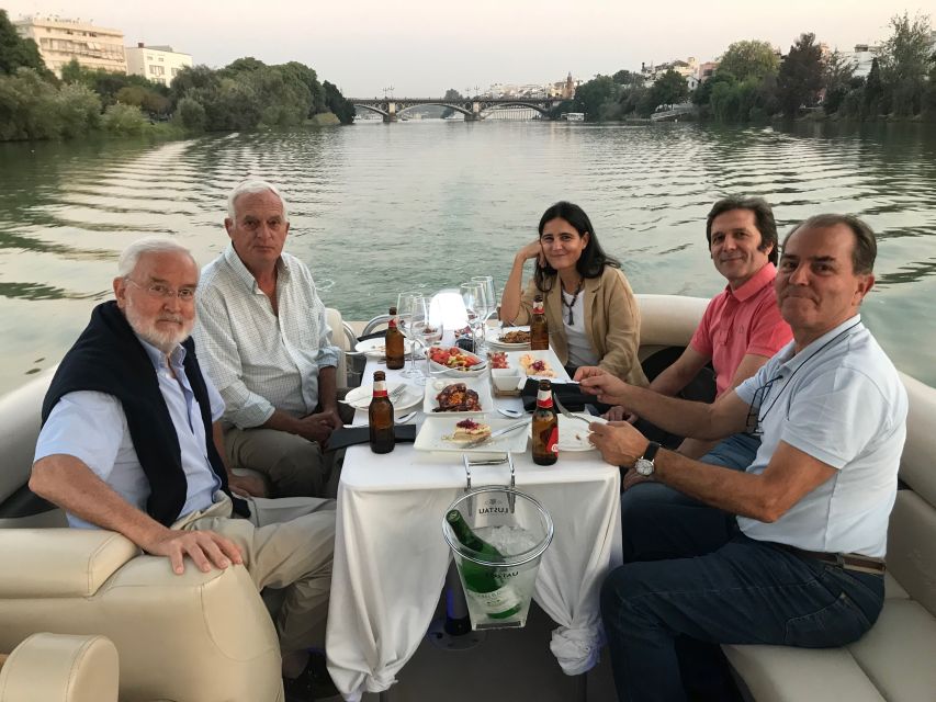 Seville: Exclusive River Boat Tour with Tapas - Tapas, drinks, music, and the small-boat setting