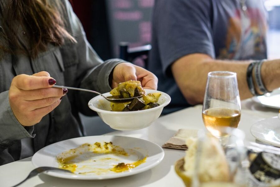 Seville: Flavors of Andalucía Guided Food Tour with Tastings - Starting across the bridge in Triana