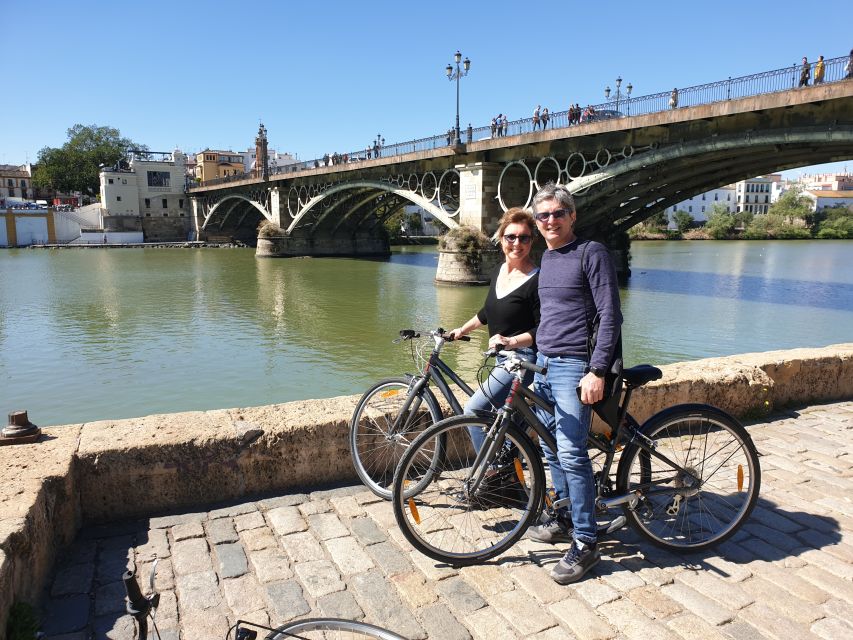 Seville: Highlights Bike Tour with Local Guide - Torre del Oro and the San Telmo district