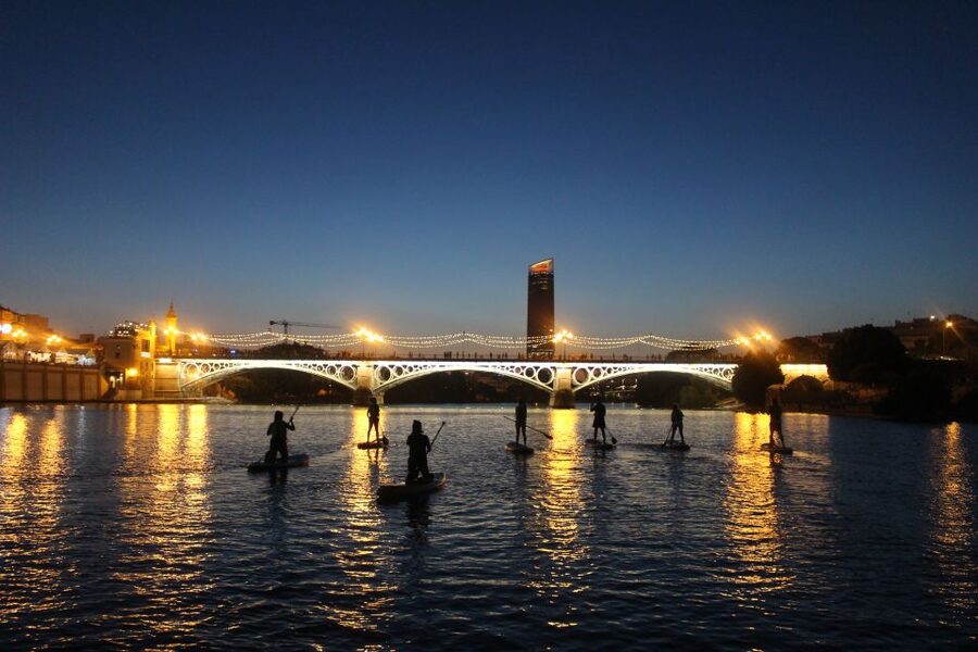 Seville: Sunset and Evening Paddle Boarding Tour - Triana Bridge and the first photo stops