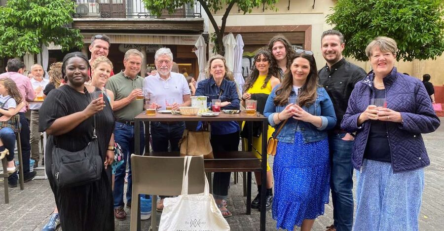 Seville: Tapas, Taverns, and History Walking Tour - Stop one: a 1900s tavern and flaming chorizo