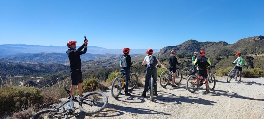 Sierra Nevada Small Group E-Bike Tour - Riding down through farms, forests, and mountain roads