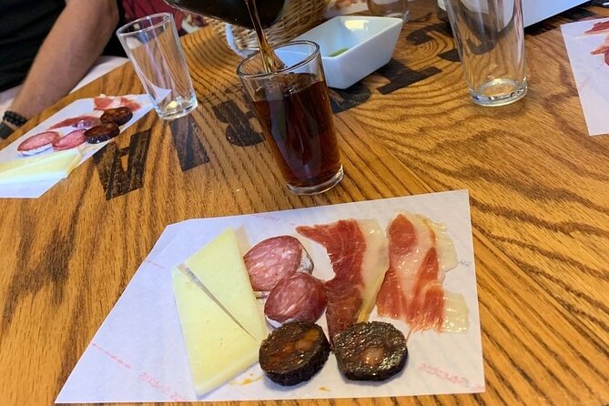 Taste of Malaga Tour : Tapas, History and Local Customs - Iberian ham and vermouth at the ultramarinos