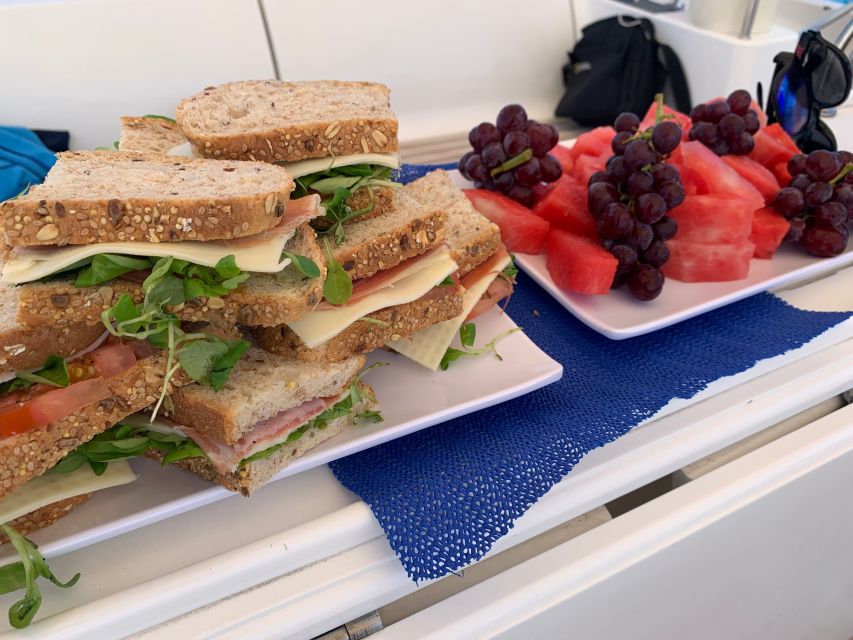 Tenerife: Sailing Excursion with Whale and Dolphin Watching - Fruit, sandwiches, and drinks on deck