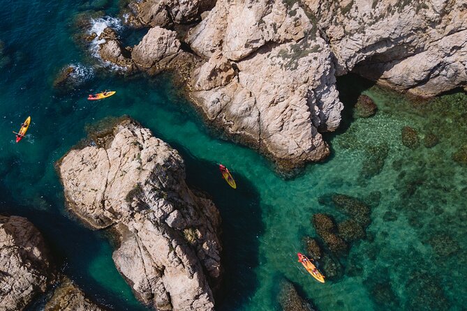 Tossa de Mar: Kayak & Snorkel Tour with Paella from Barcelona - Kayaking past cliffs, coves, and sea caves