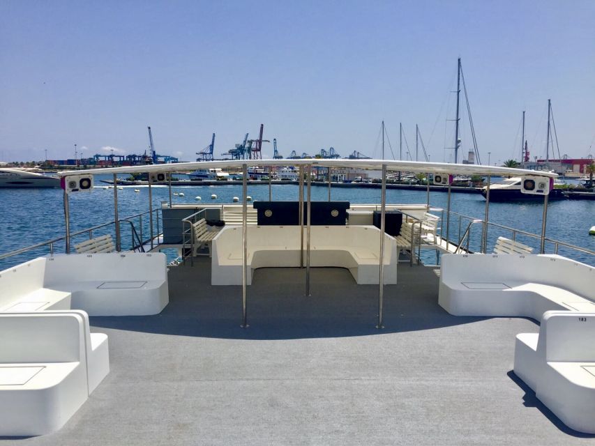 Valencia: Catamaran Cruise with Stop for Swimming - Leaving Valencia from the Clock Building
